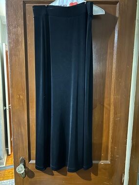 Black Women’s Maxi Skirt - Classic A-Line w/ small slit on bottom left.